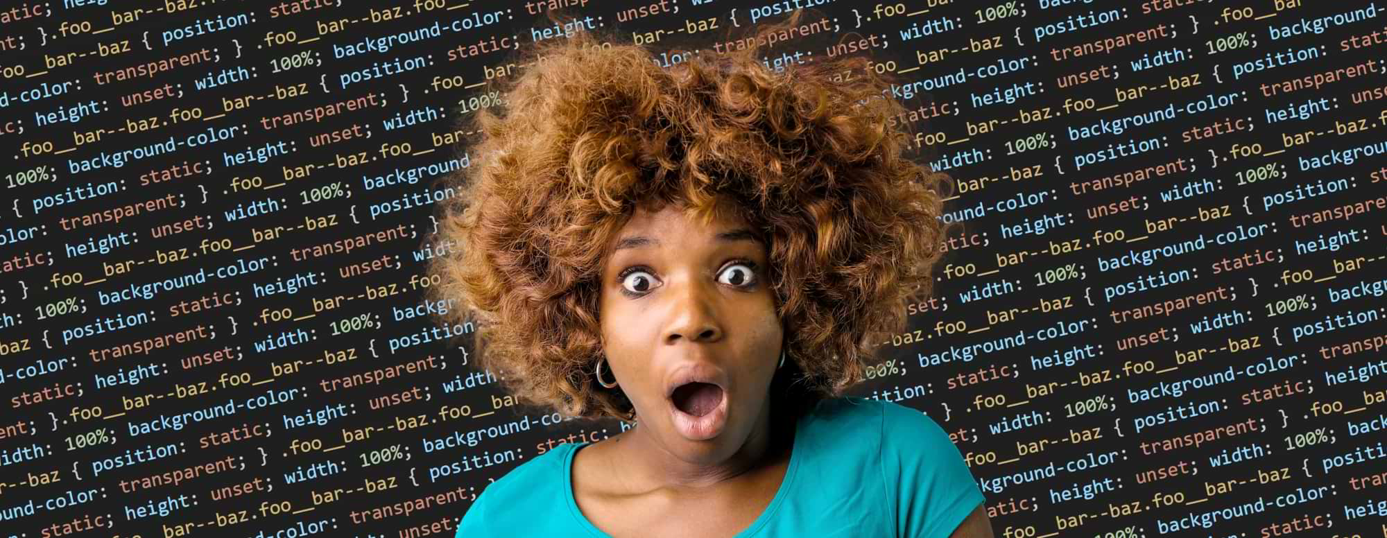 Medium shot of a surprised woman standing in front of endless CSS code.