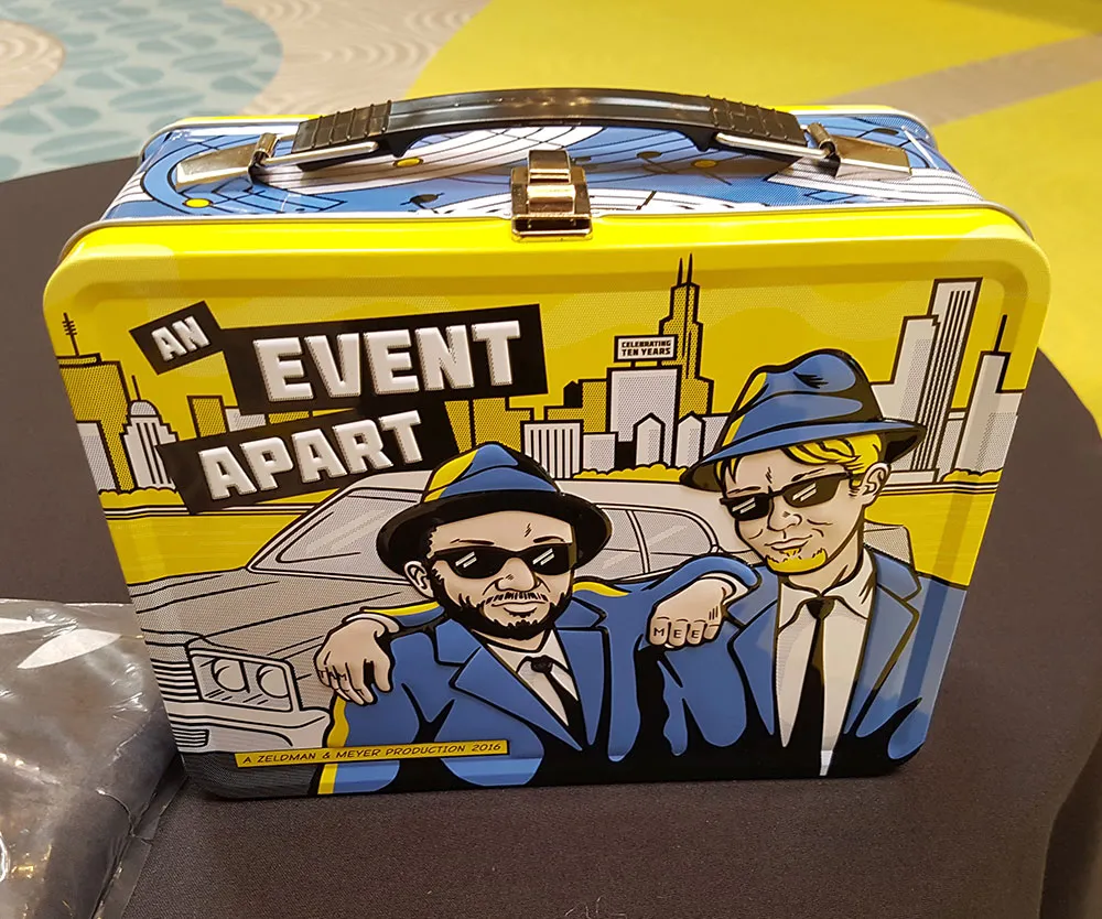 Photo of a yellow, metal lunchbox .