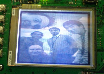 A close-up of the screen on a development board displaying a camera viewfinder. Rahul, Matthew, Brian, Jason & Hitesh are all visible in the viewfinder