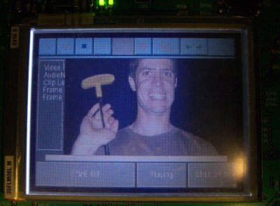 A close-up of the screen on a development board displaying a photo of David